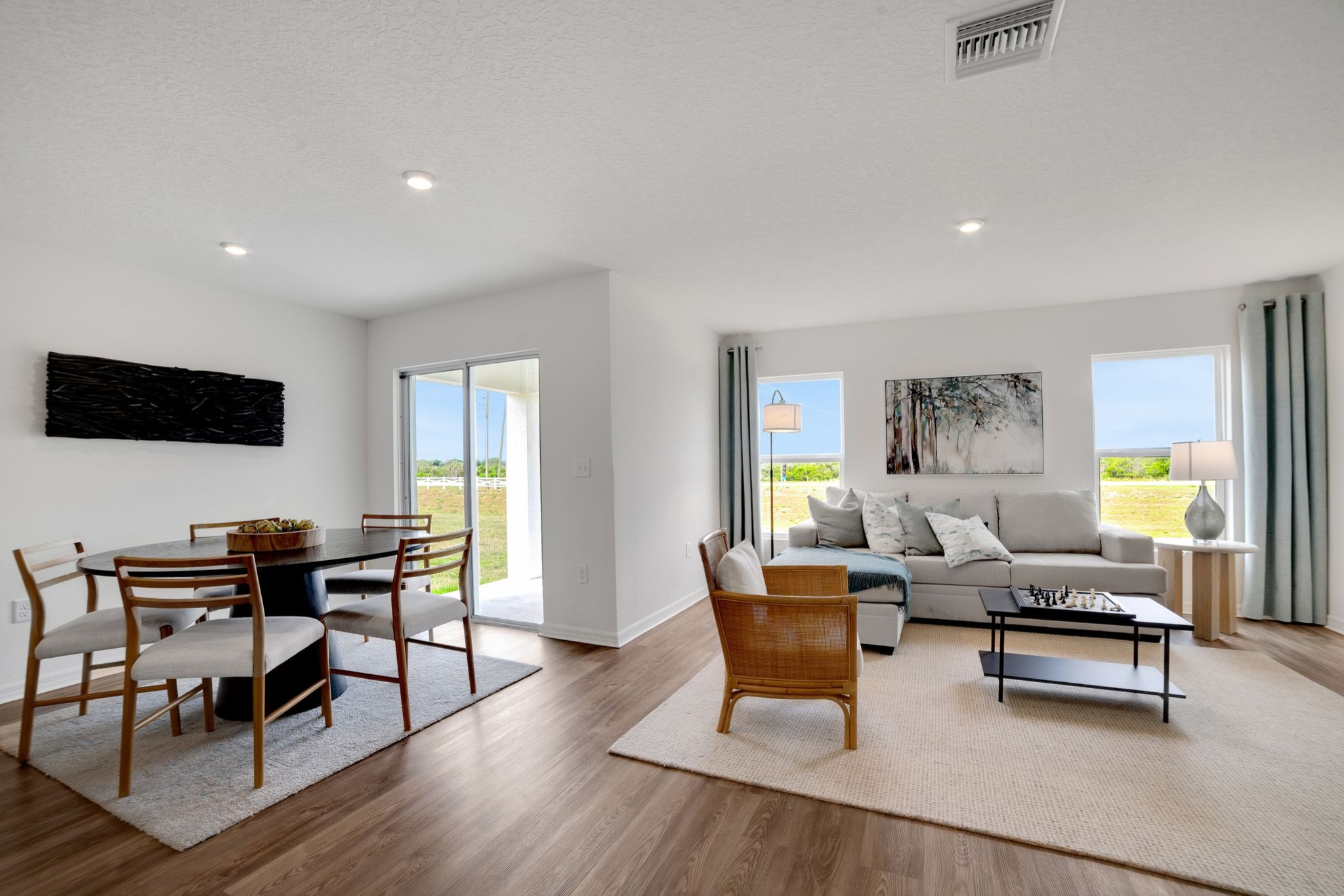 A living room with a large glass door.