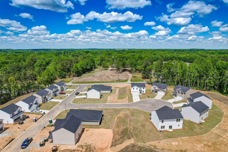 A group of houses and trees.