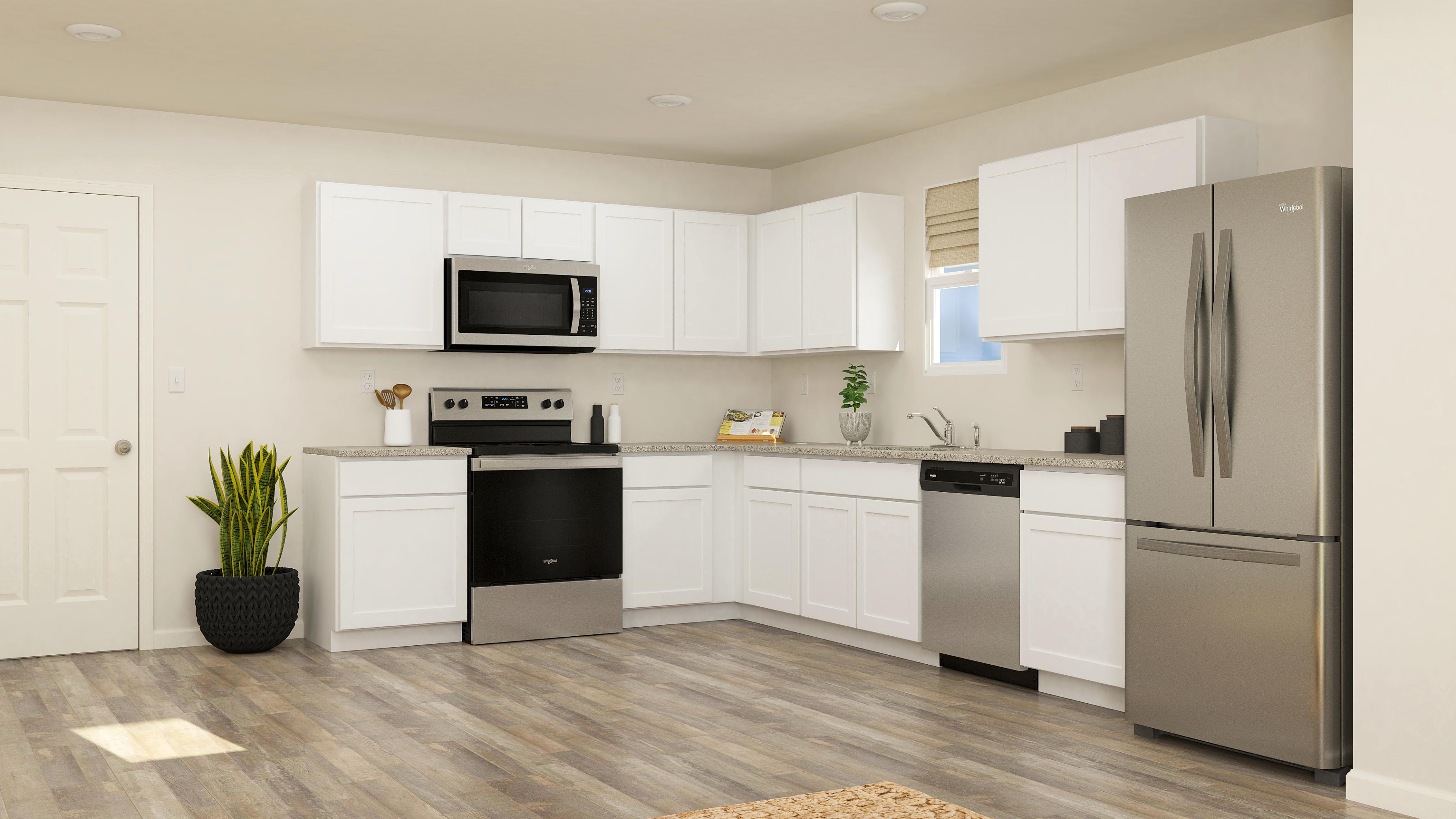 A kitchen with white cabinets.