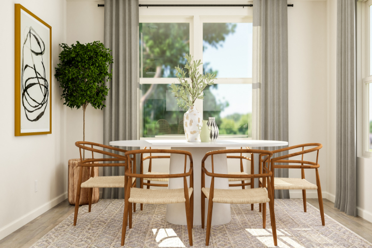 A dining table with chairs around it.