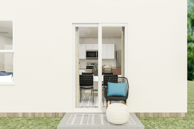 A room with a table chairs and a glass door.